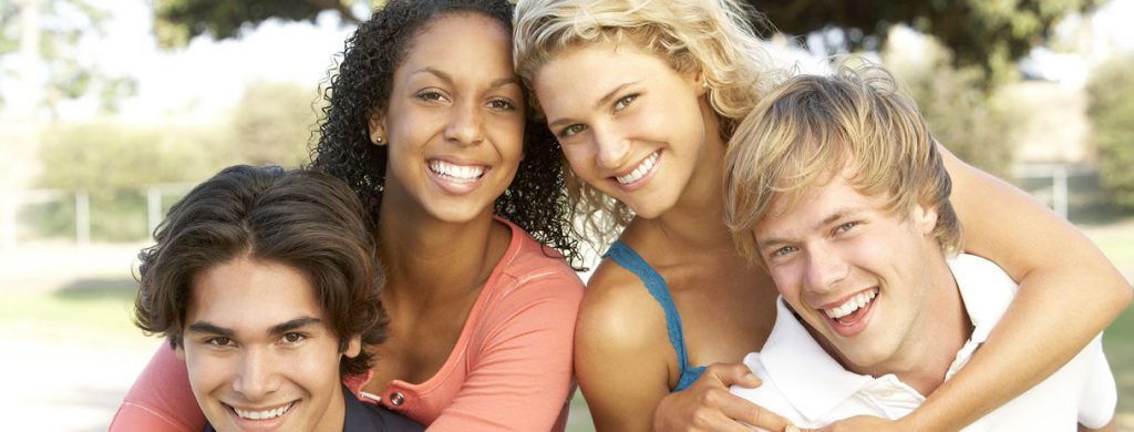 Stock image of two women and two men smiling